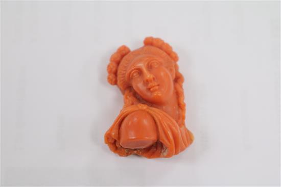 A carved coral bust of a lady (ex brooch mounted), 33mm.